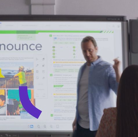 teacher with cambridge one on whiteboard