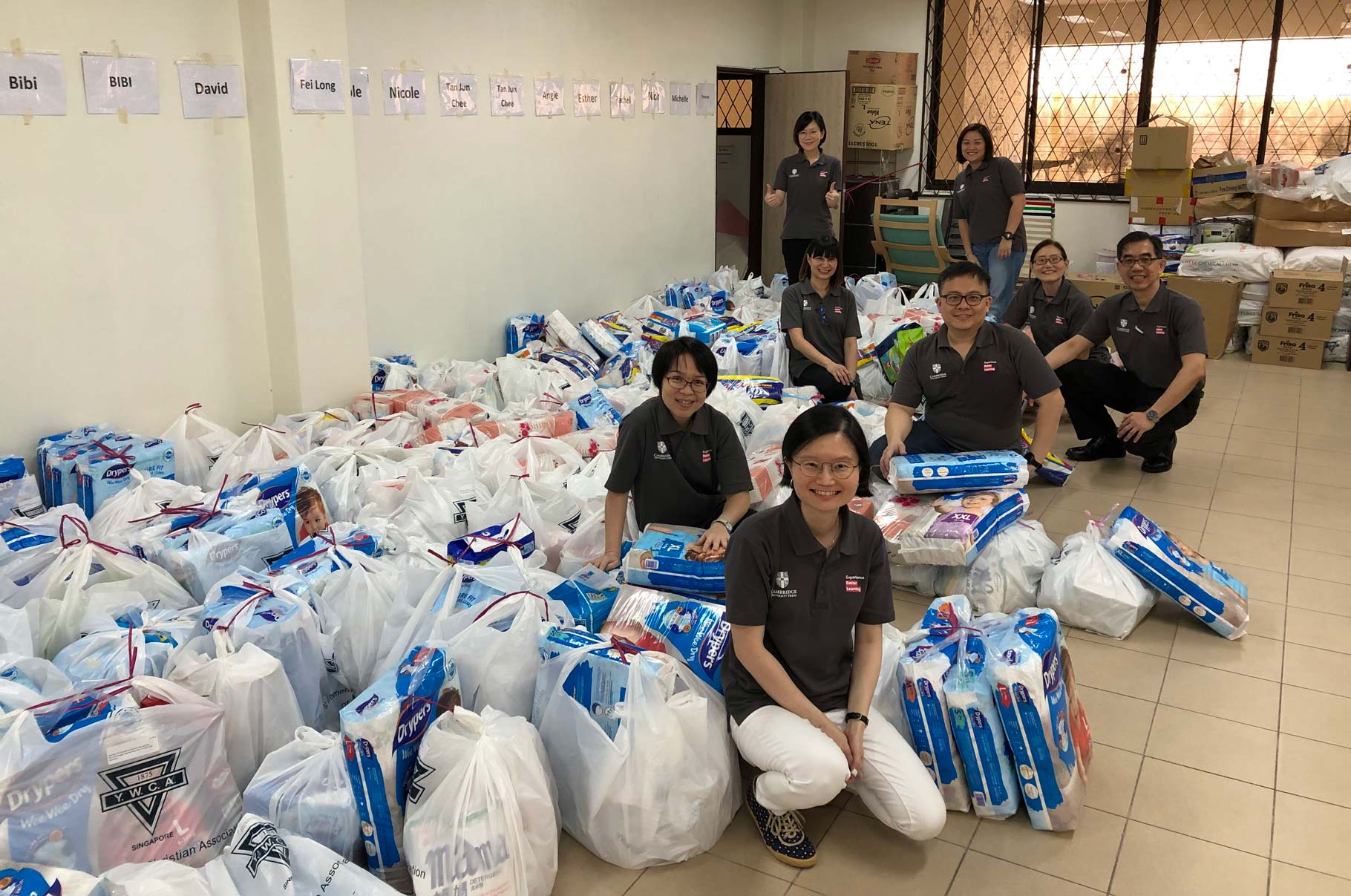 Colleagues in Singapore support the YWCA’s ‘Sustenance for Families Packing’ programme