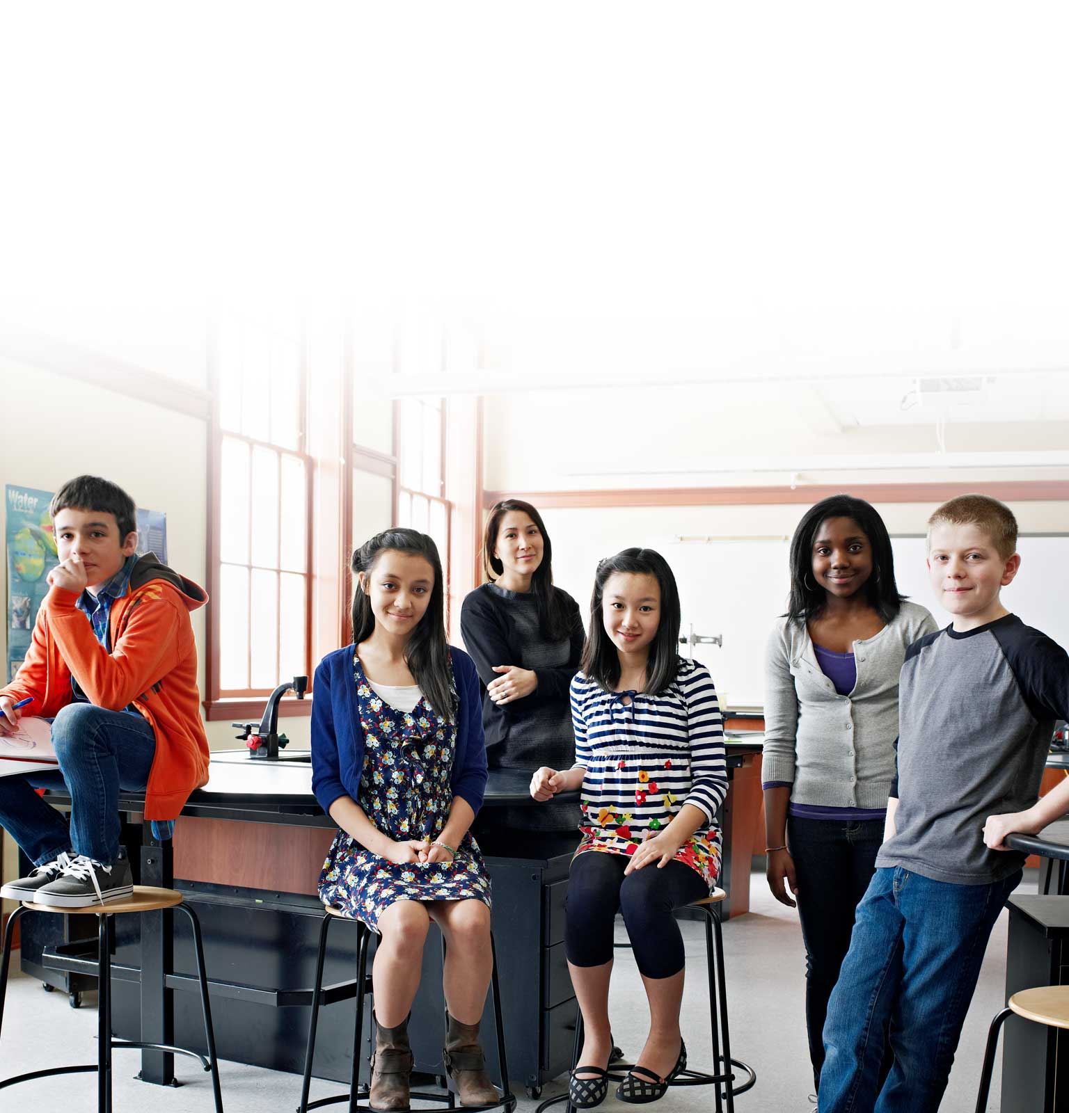 Pupils and teacher in modern classroom.