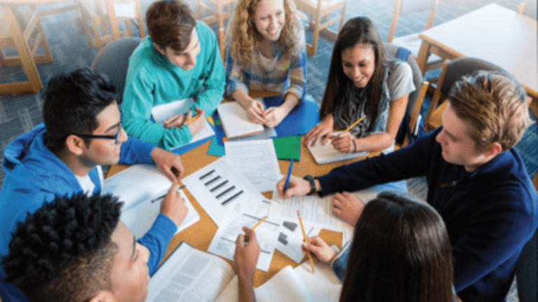 Cambridge IELTS expert explaining to students.
