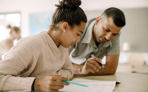 Teacher talking to student