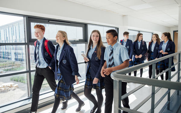 Students walking down a corridor