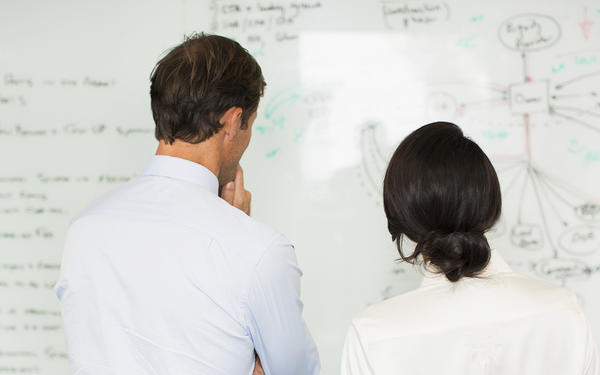 Teachers looking at whiteboard