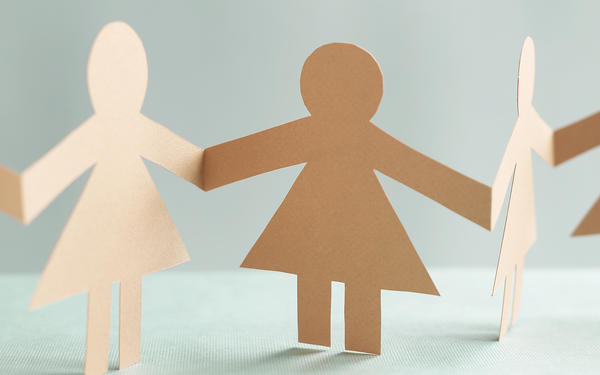 a chain of paper dolls