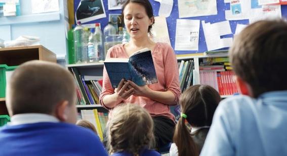 Teacher reading to students in classroom