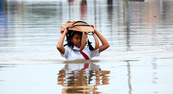 Young student in flood water