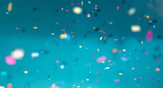 Confetti falling on a blue background