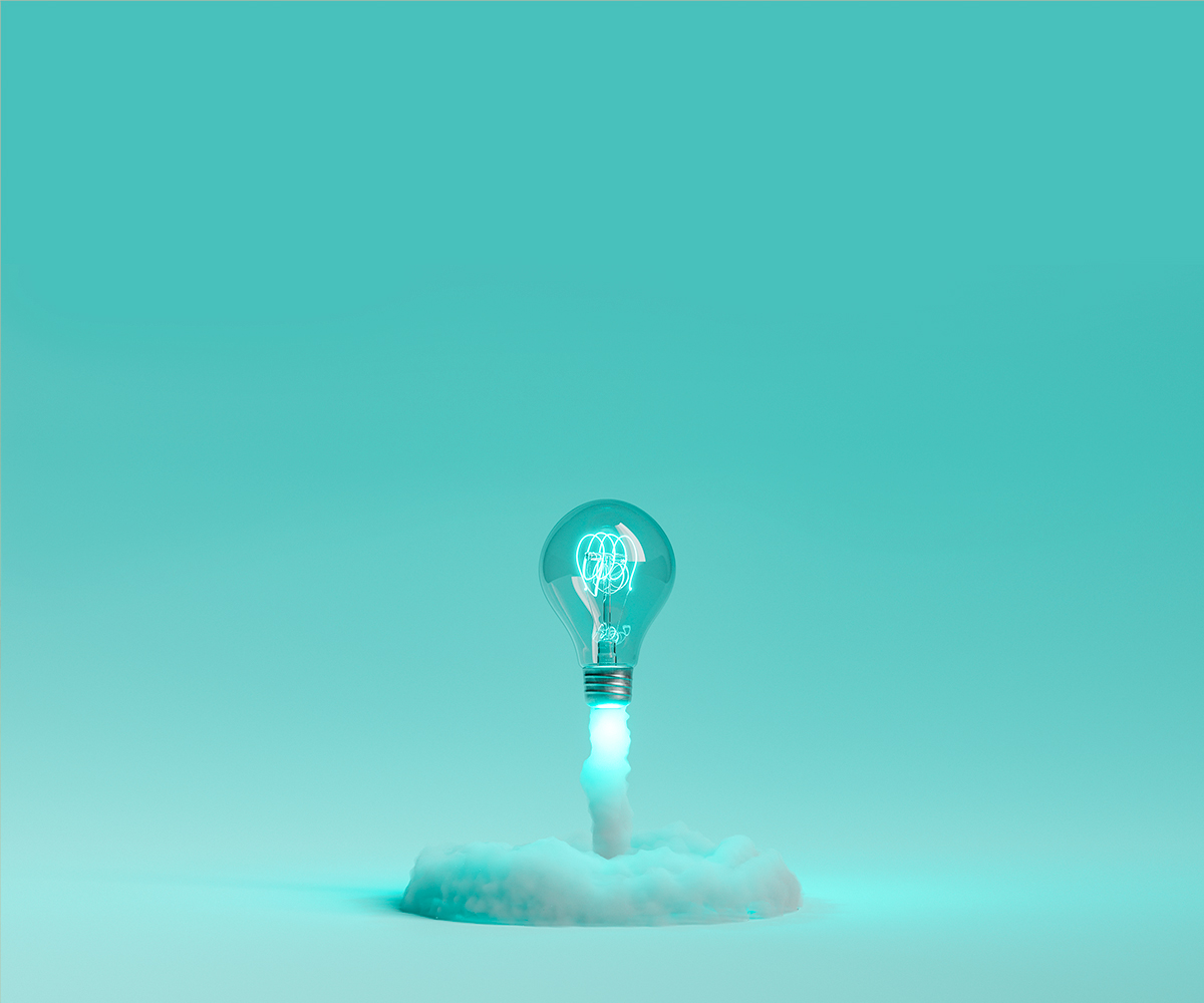 Lightbulb launching and releasing smoke on a blue background